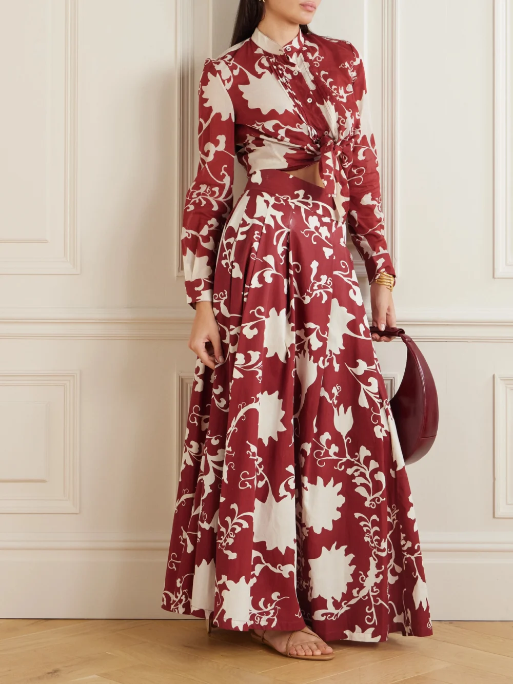 Emporio Sirenuse Flaminia Pleated Floral-print Cotton-gabardine Maxi Skirt, worn by a model