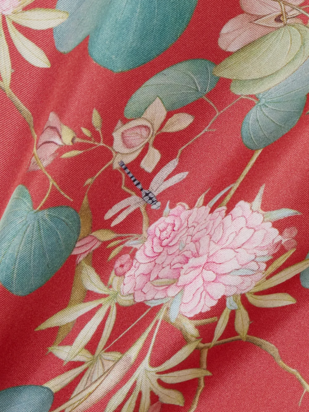 Close-up detail of the Emporio Sirenuse Laurelle Dragonfly Floral-print Silk-twill Maxi Skirt
