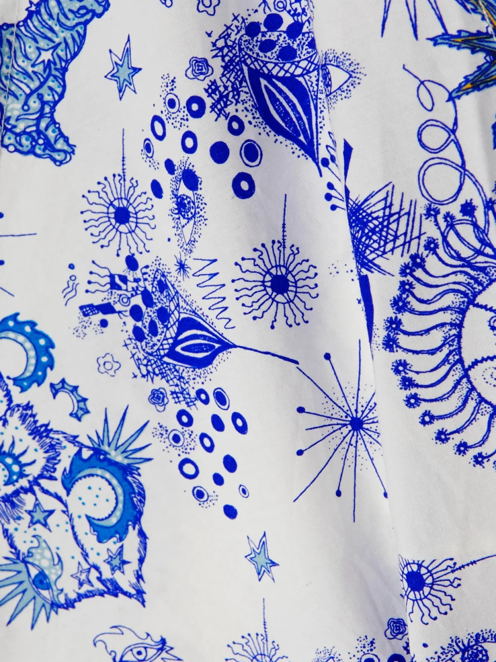 Close-up detail of the Emporio Sirenuse Sonia Cropped Bow-detailed Printed Cotton-poplin Top