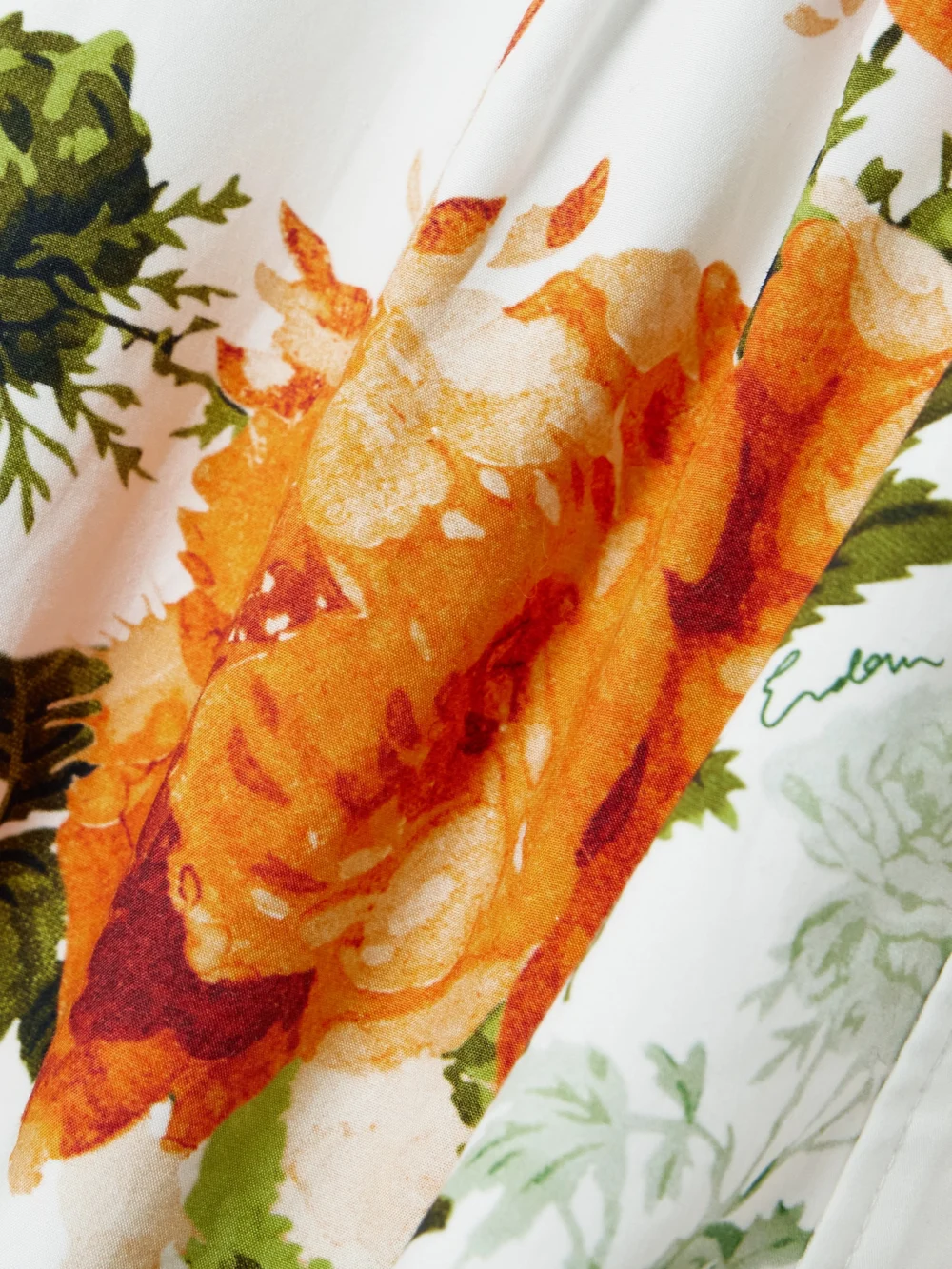 Close-up detail of the Erdem Asymmetric Pleated Floral-print Cotton-poplin Mini Shirt Dress