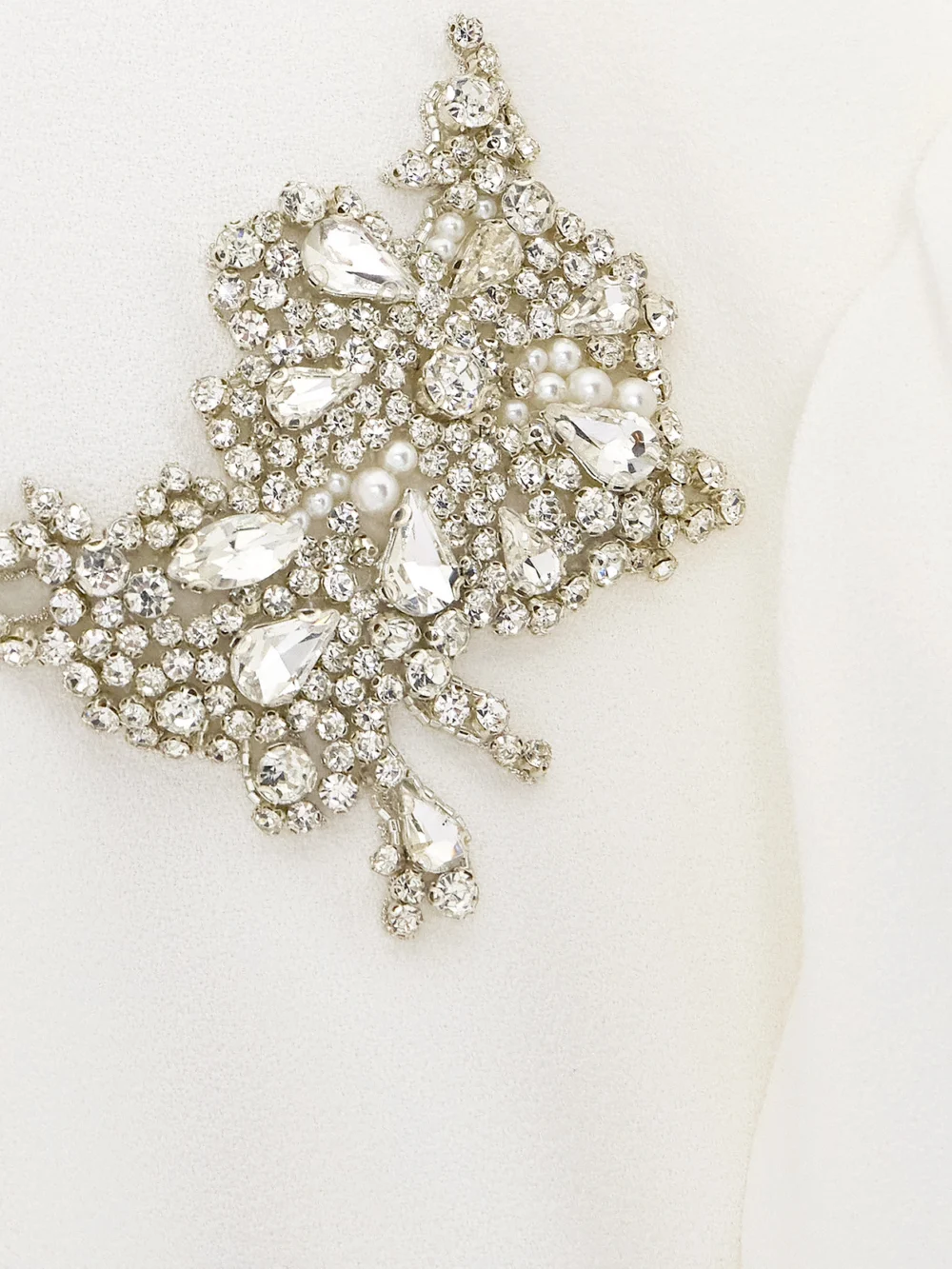 Close-up detail of the Erdem Embellished Crepe Peplum Midi Dress