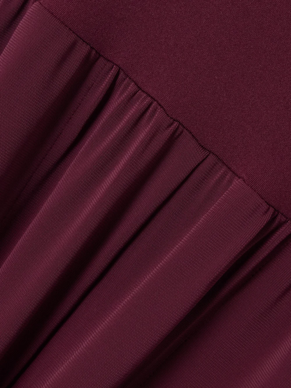 Close-up detail of the Eres Les Essentiels Dao Convertible Stretch-jersey Jumpsuit