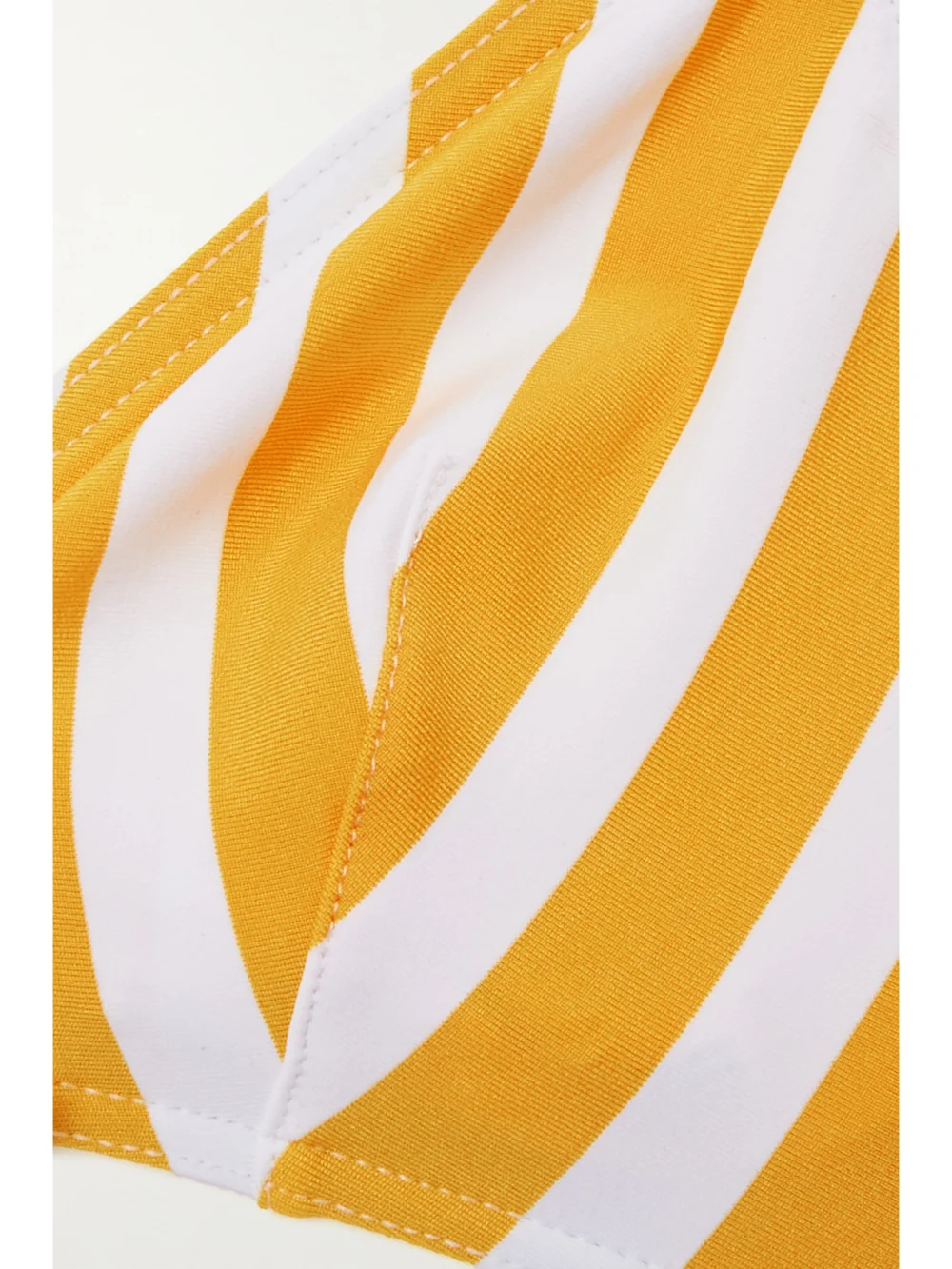 Close-up detail of the Eres Samba Mucho Eyelet-embellished Striped Triangle Bikini Top