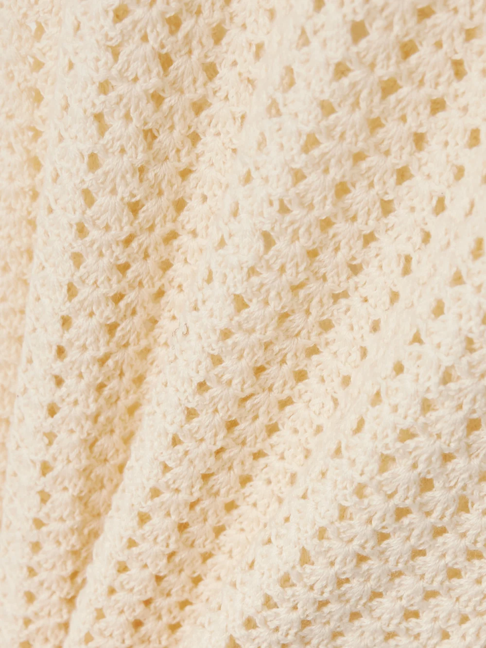 Close-up detail of the Escvdo Misha Open-back Crocheted Cotton Maxi Dress