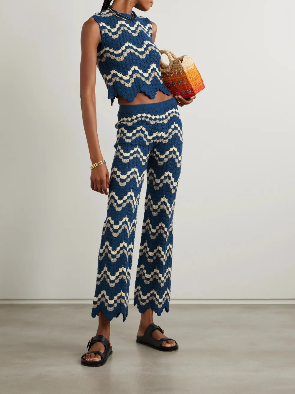 Escvdo Safi Scalloped Crocheted Organic Cotton Bootcut Pants, worn by a model