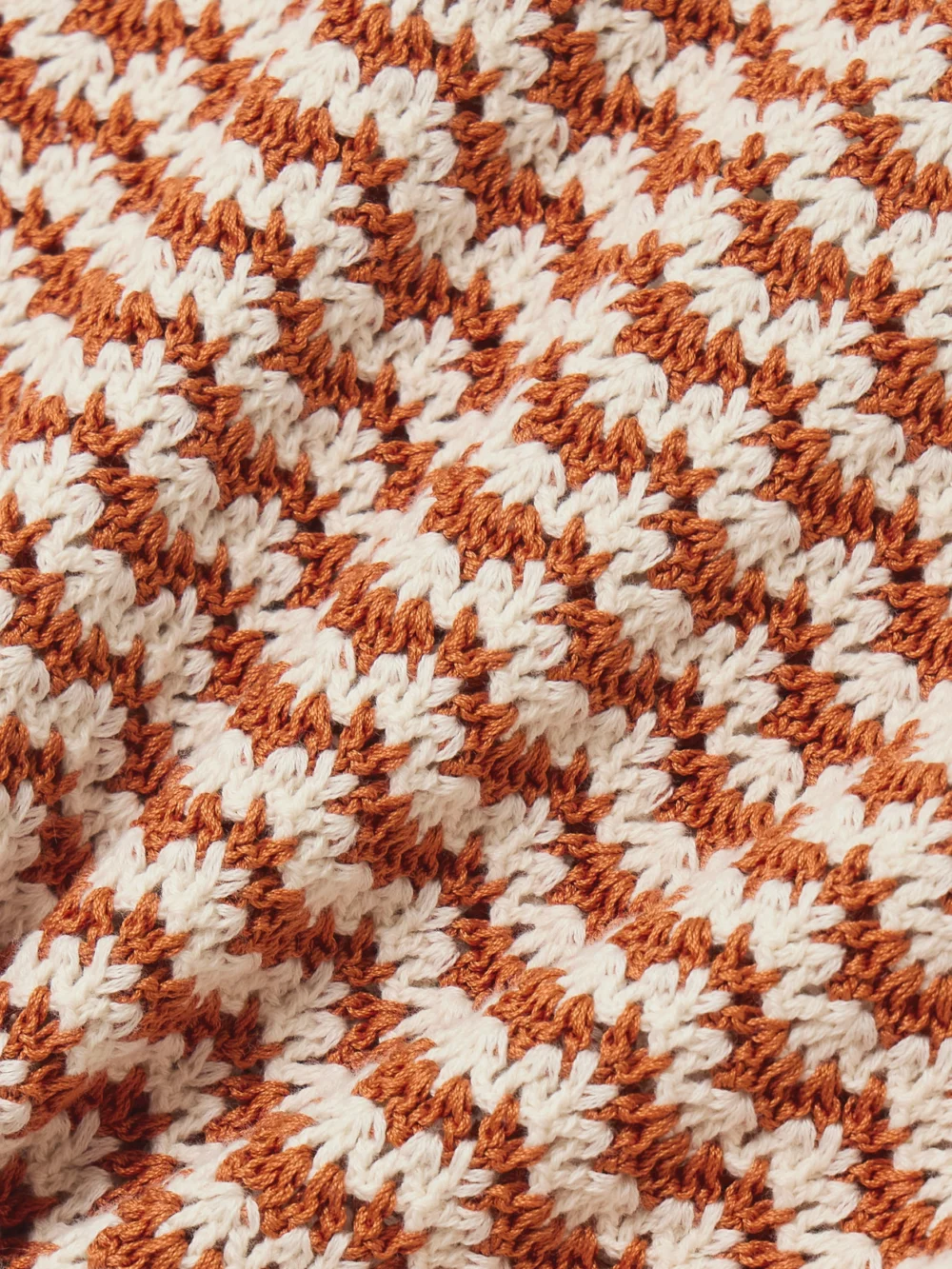 Close-up detail of the Escvdo Striped Crocheted Cotton Mini Skirt