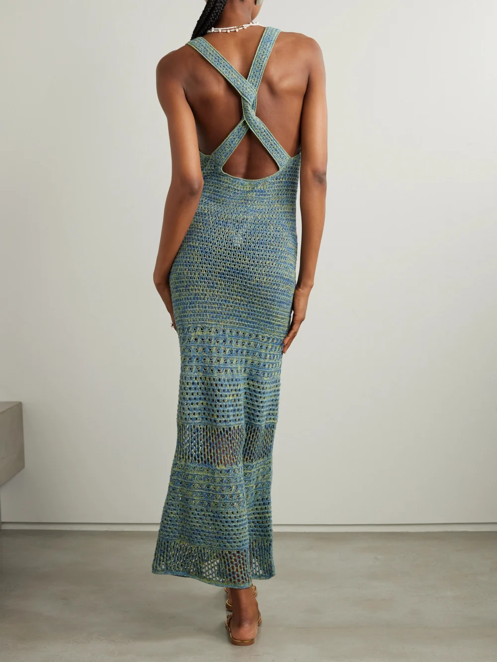 Back view of the Escvdo Twist-back Pointelle-knit Cotton Maxi Dress