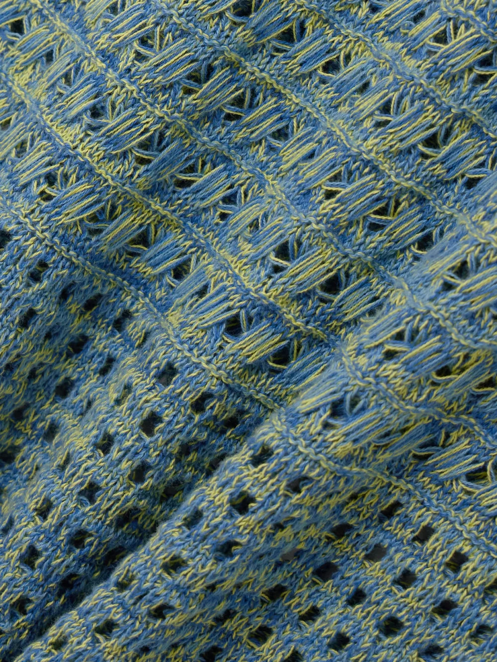 Close-up detail of the Escvdo Twist-back Pointelle-knit Cotton Maxi Dress