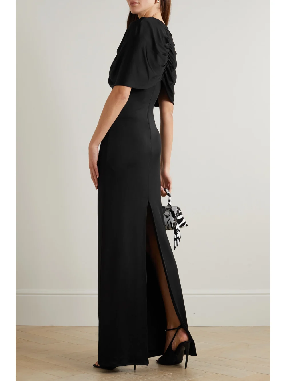Back view of the Et Ochs Cape-effect Cutout Ruched Stretch-jersey Gown