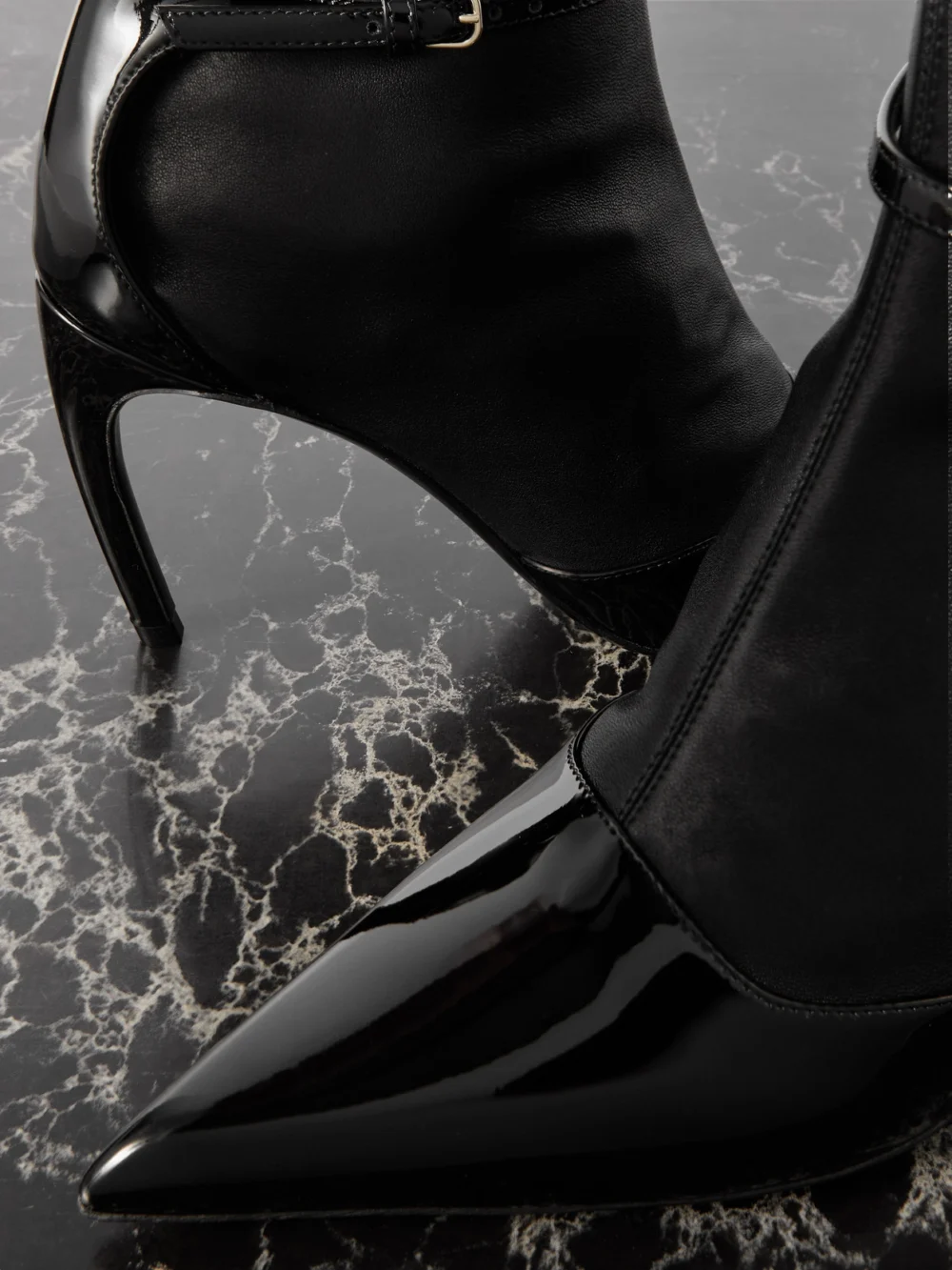 Close-up detail of the Ferragamo Britt Smooth and Patent-leather Ankle Boots