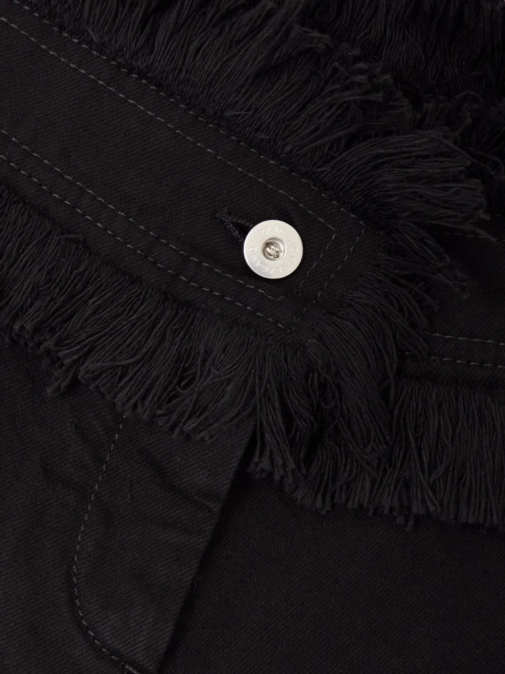 Close-up detail of the Ferragamo Frayed Denim Shorts