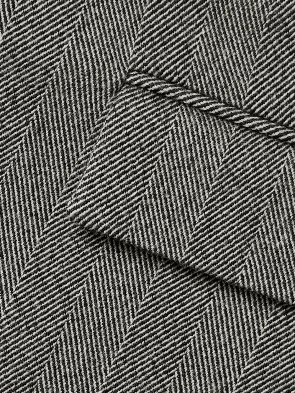 Close-up detail of the Ferragamo Herringbone Wool-blend Mini Skirt