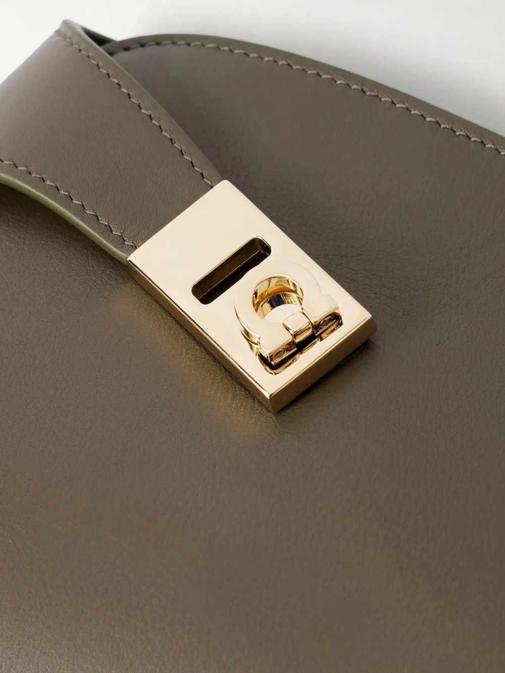 Close-up detail of the Ferragamo Hug Embellished Textured-leather Shoulder Bag