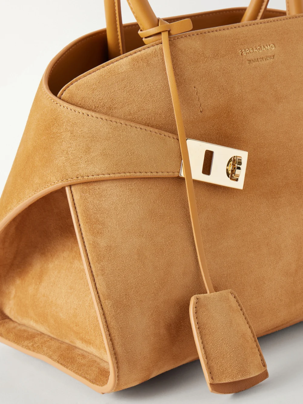 Close-up detail of the Ferragamo Hug Small Embellished Leather-trimmed Suede Tote
