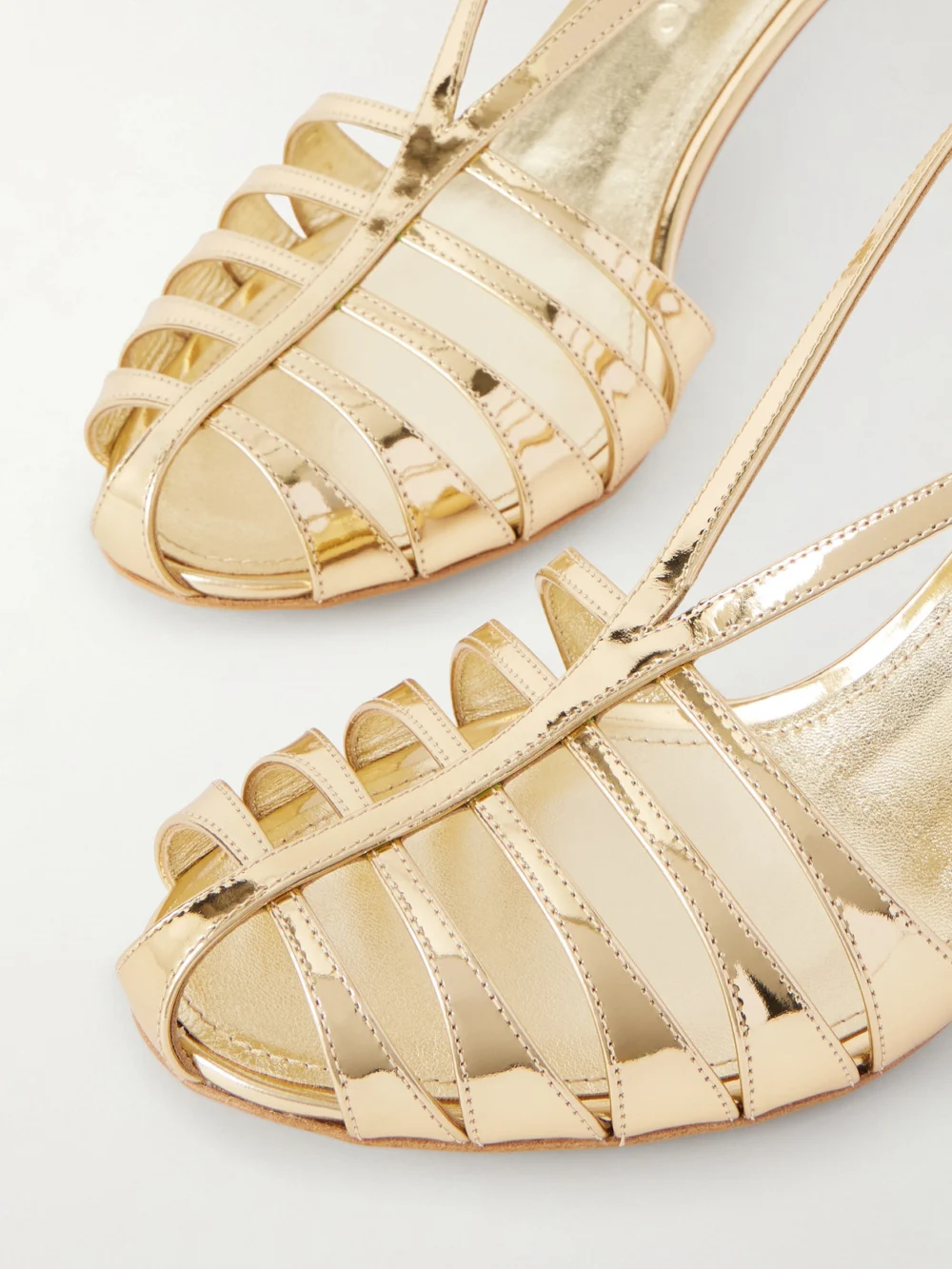 Close-up detail of the Ferragamo Lilie Metallic-leather Sandals
