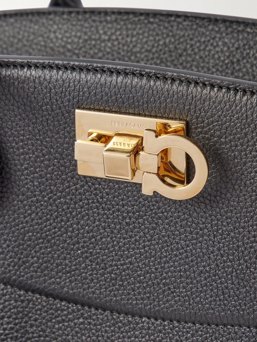 Close-up detail of the Ferragamo Studio East West Suede-trimmed Textured-leather Shoulder Bag