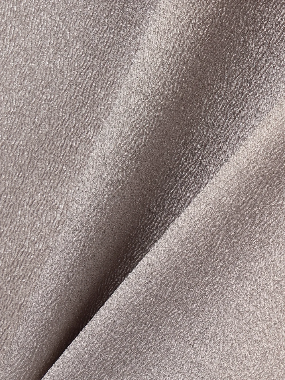 Close-up detail of the Fforme Angee Asymmetric Metallic Cloqué Mimi Dress