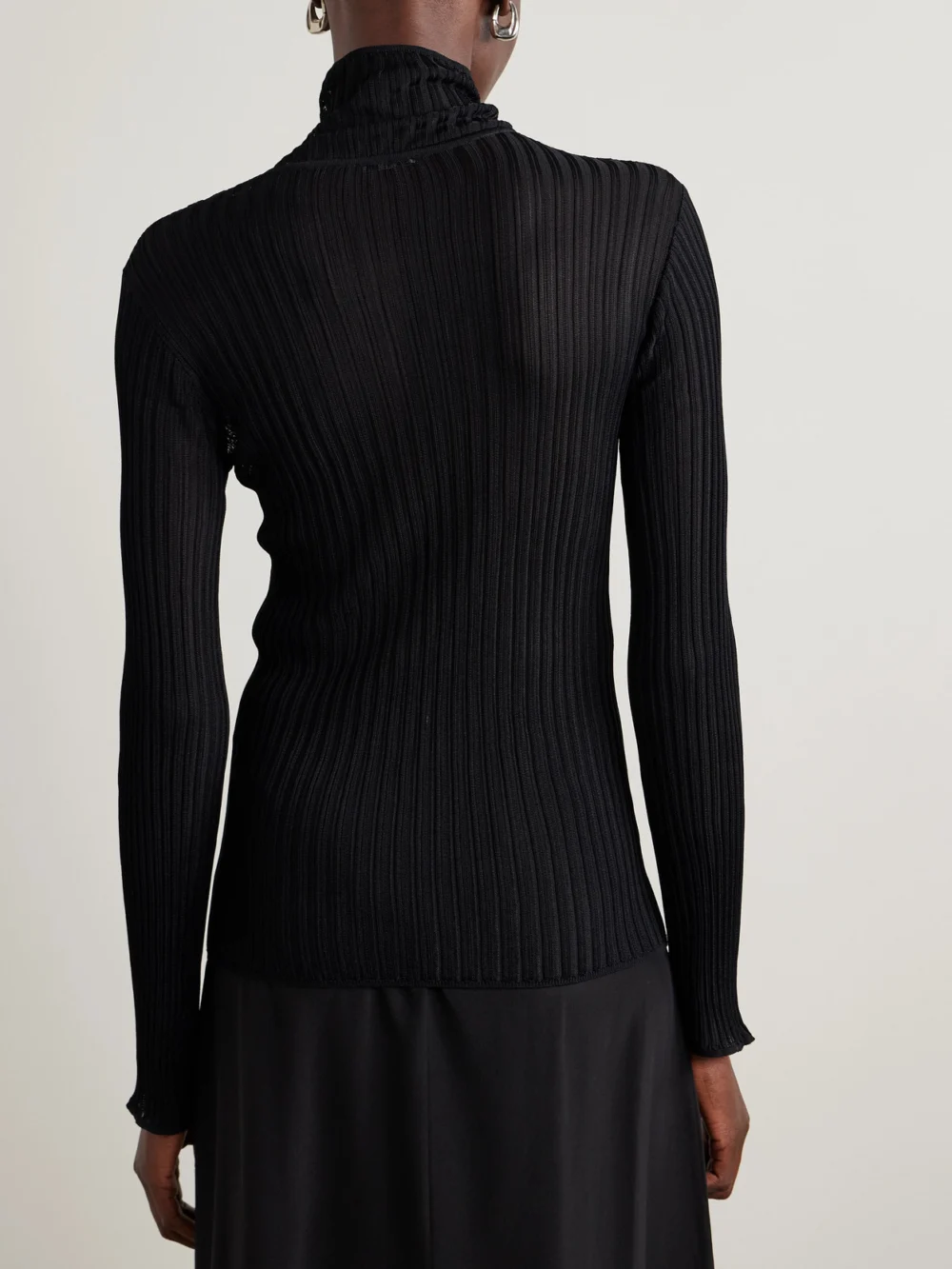 Back view of the Fforme Elin Ribbed-knit Turtleneck Sweater