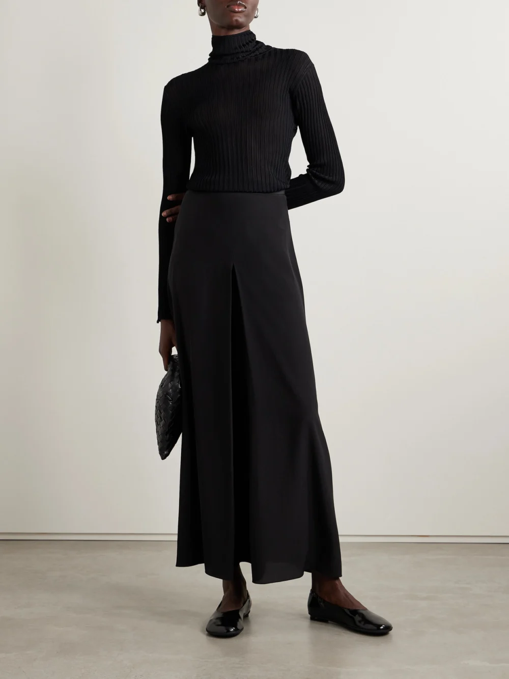 Fforme Elin Ribbed-knit Turtleneck Sweater, worn by a model