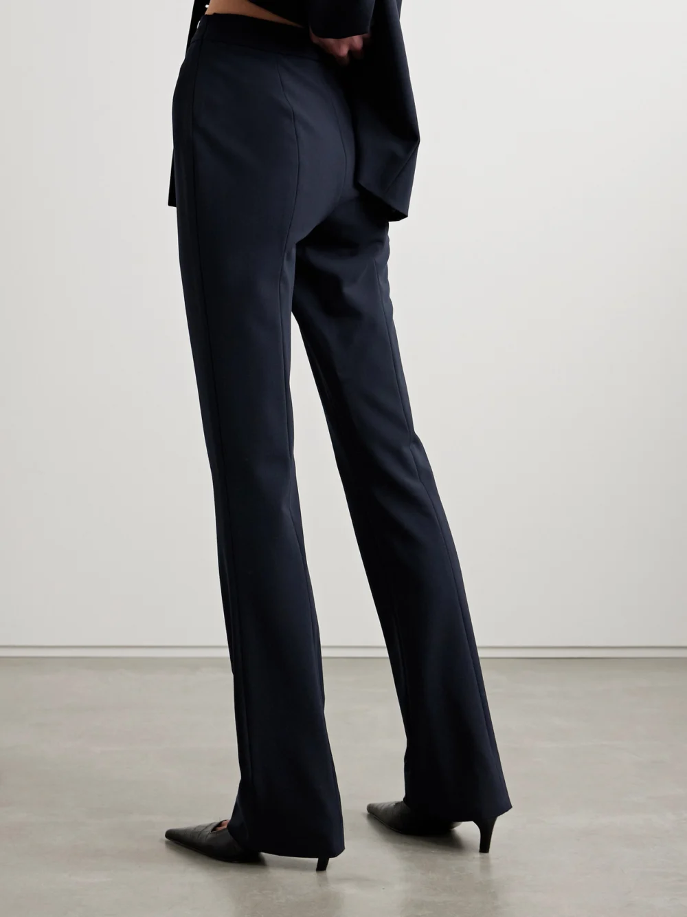 Back view of the Fforme Jem Wool-blend Crepe Flared Pants