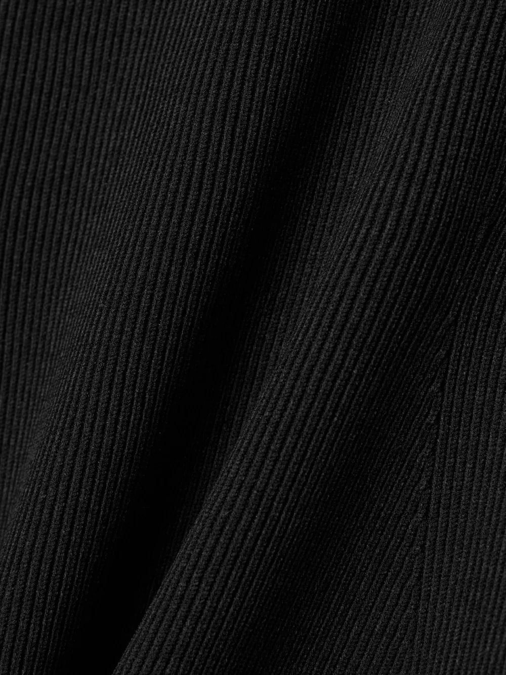Close-up detail of the Fforme Saiba Ribbed-knit Midi Dress