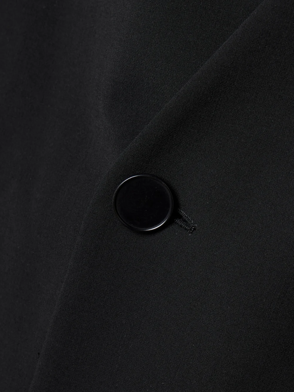 Close-up detail of the Fforme Velma Double-breasted Wool-blend Crepe Blazer