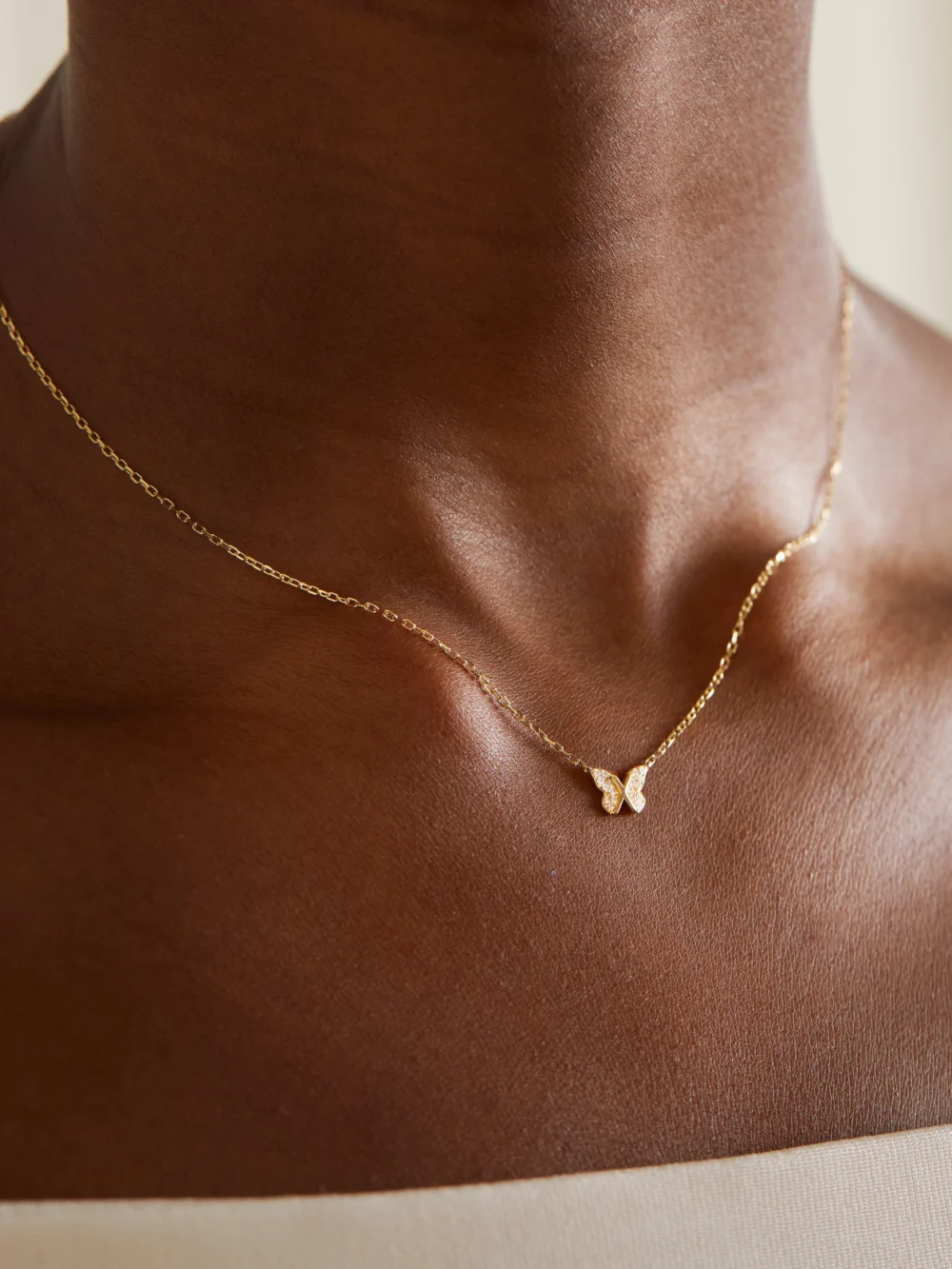 FoundRae Butterfly 18-karat Gold Diamond Necklace, styled view