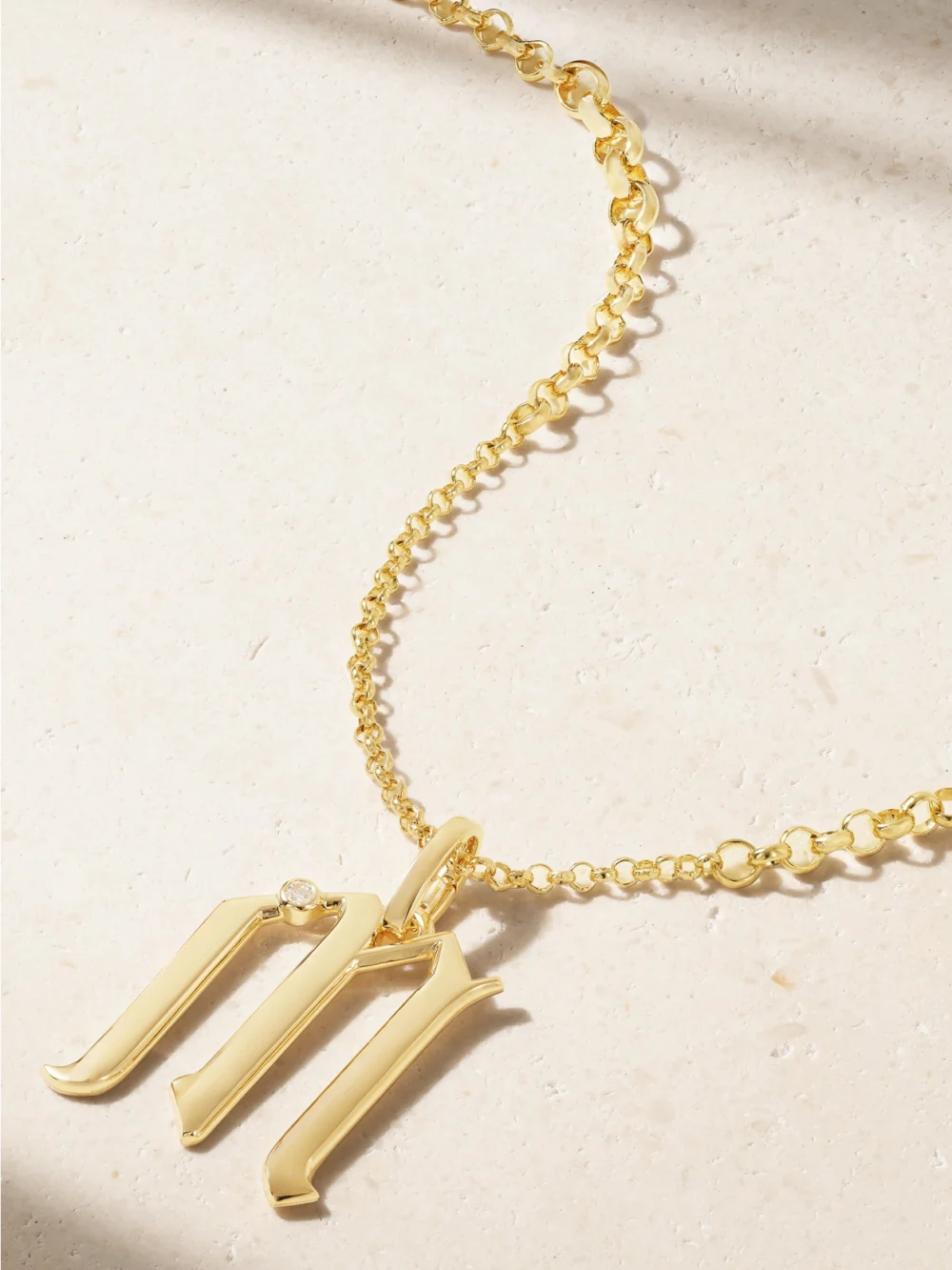 Close-up detail of the FoundRae Initials 18-karat Gold Diamond Pendant