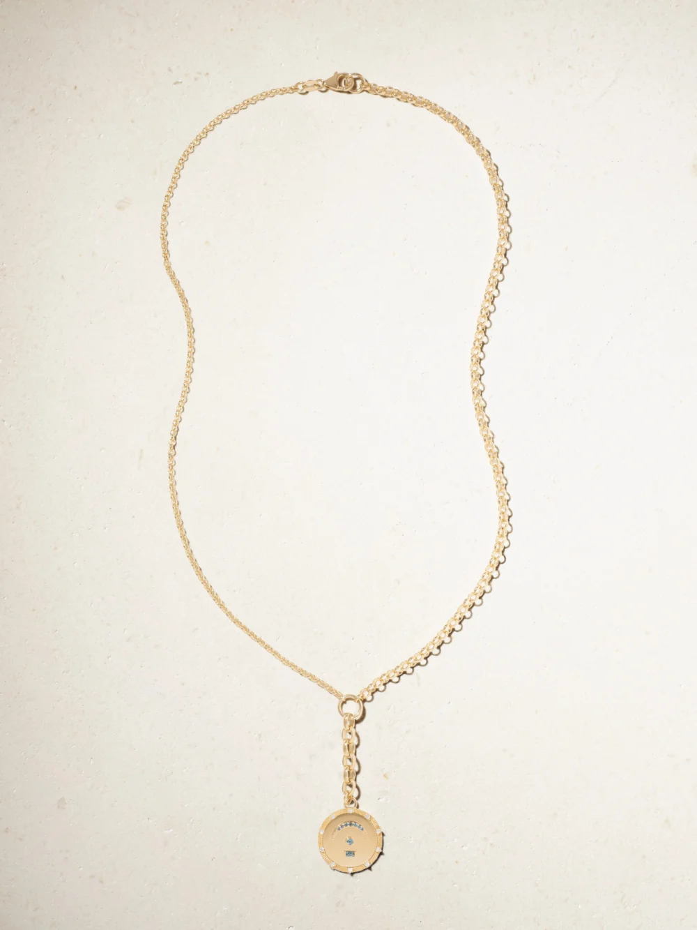 Close-up detail of the FoundRae Pause Internal Compass 18-karat Gold, Topaz and Diamond Necklace