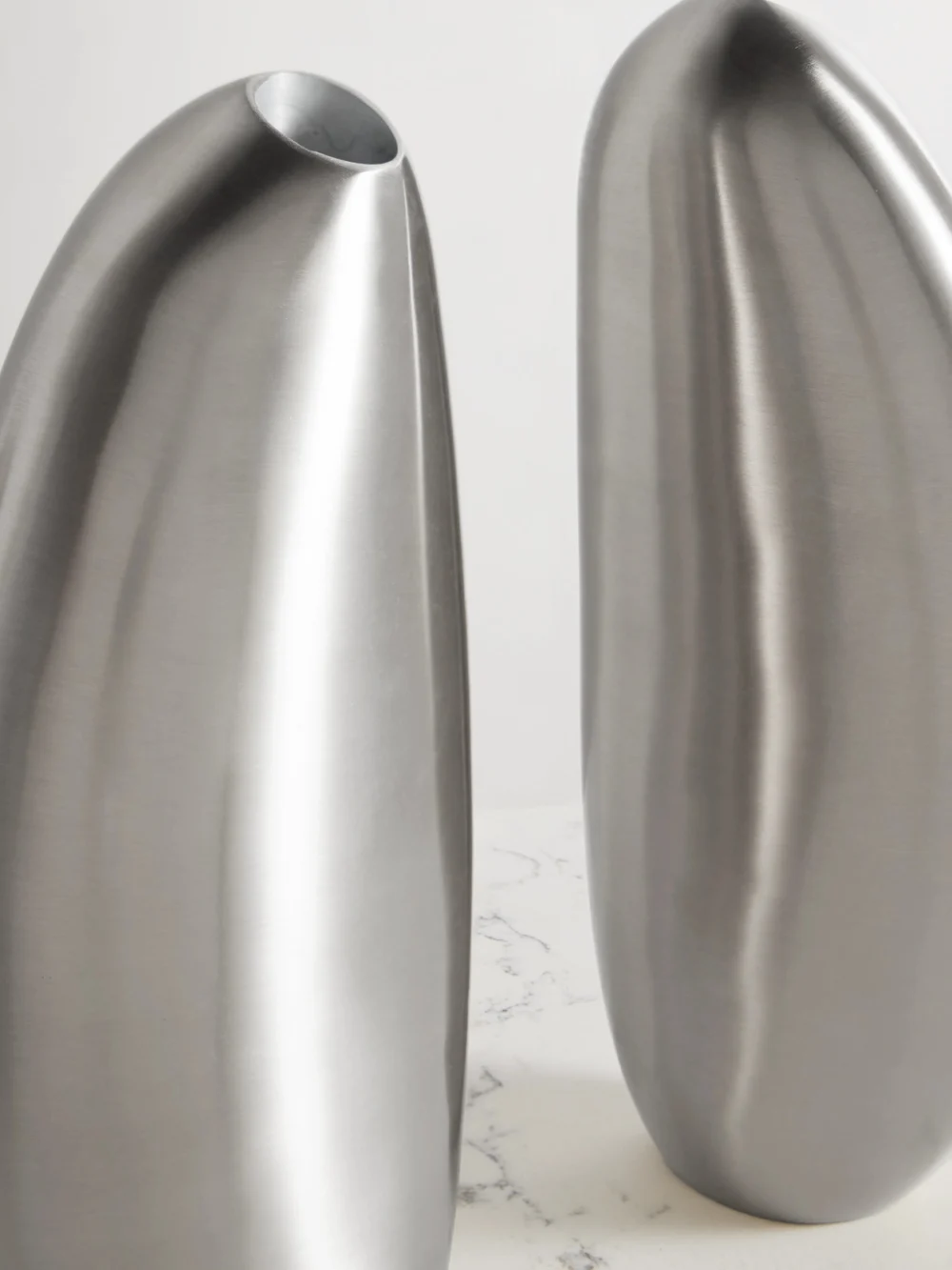 Close-up detail of the Fourth Street Puddle Set of Three Silver-tone Candlesticks