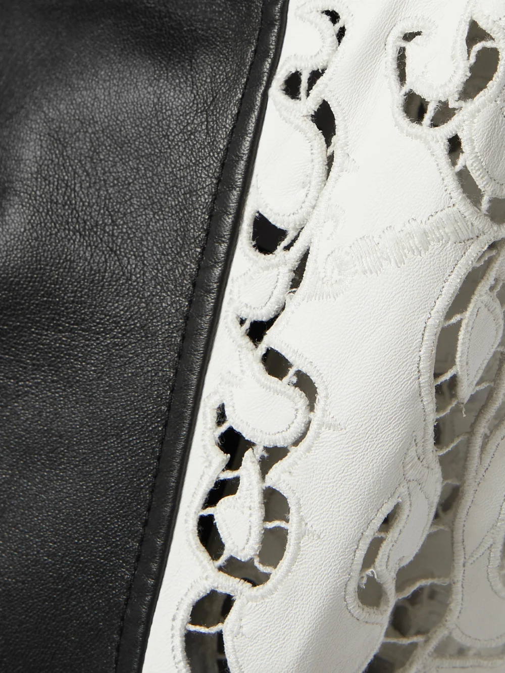 Close-up detail of the Gabriela Hearst Abami Paneled Lace Motif Leather Maxi Dress