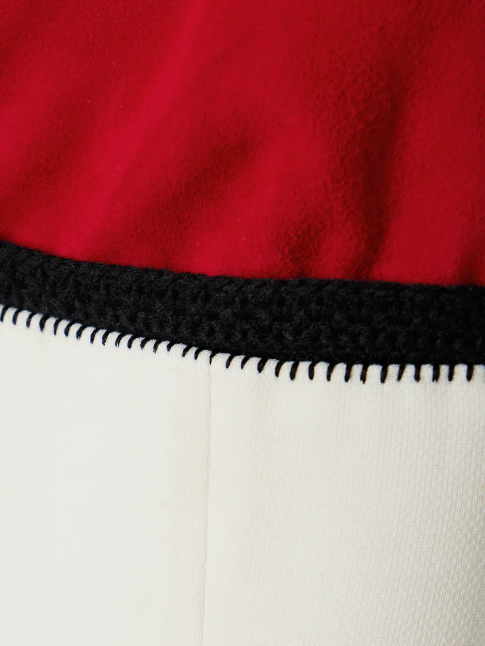 Close-up detail of the Gabriela Hearst Edina Crochet and Suede-trimmed Wool Midi Dress