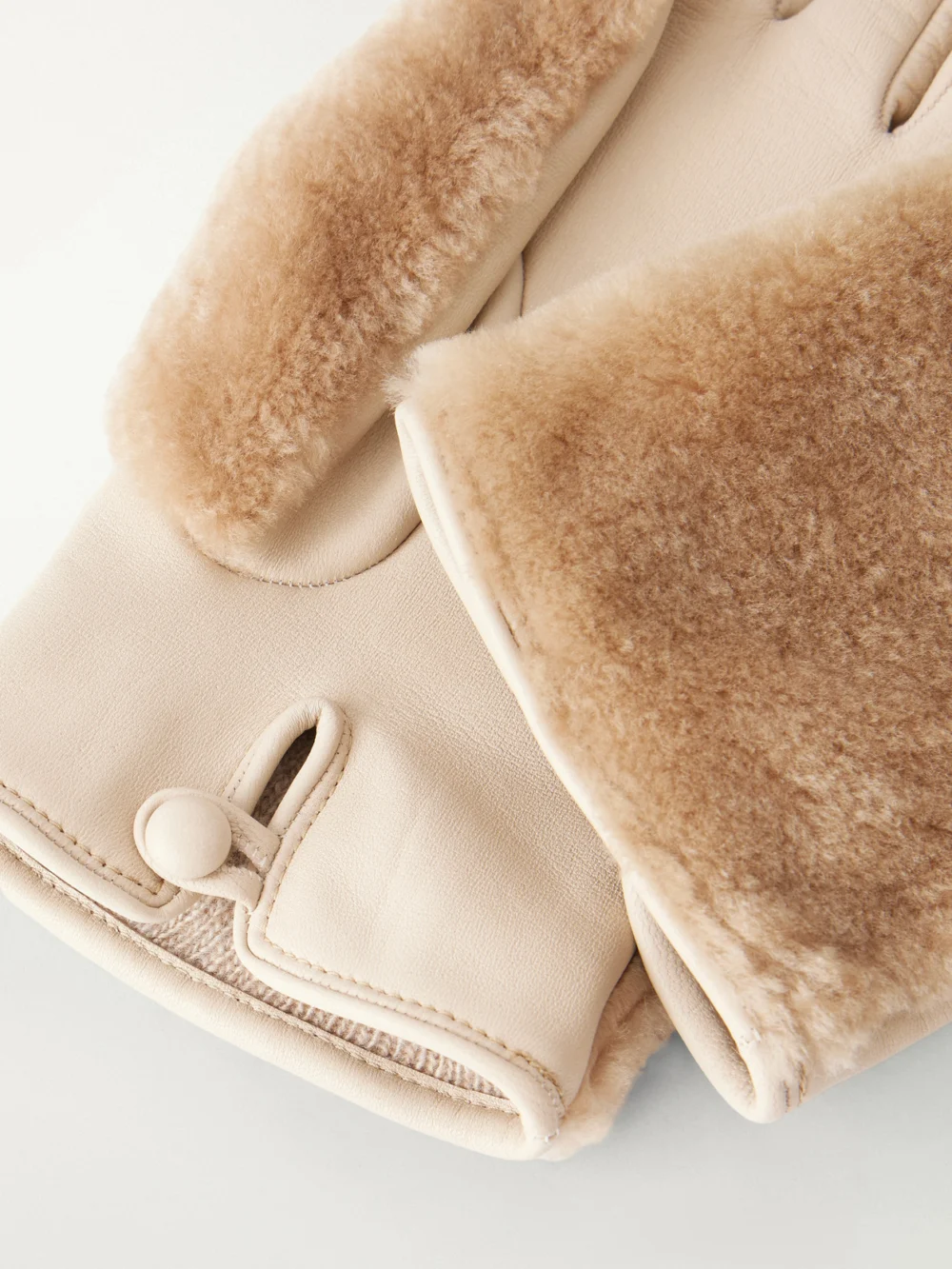 Close-up detail of the Gabriela Hearst Eglantina Leather-trimmed Shearling Gloves