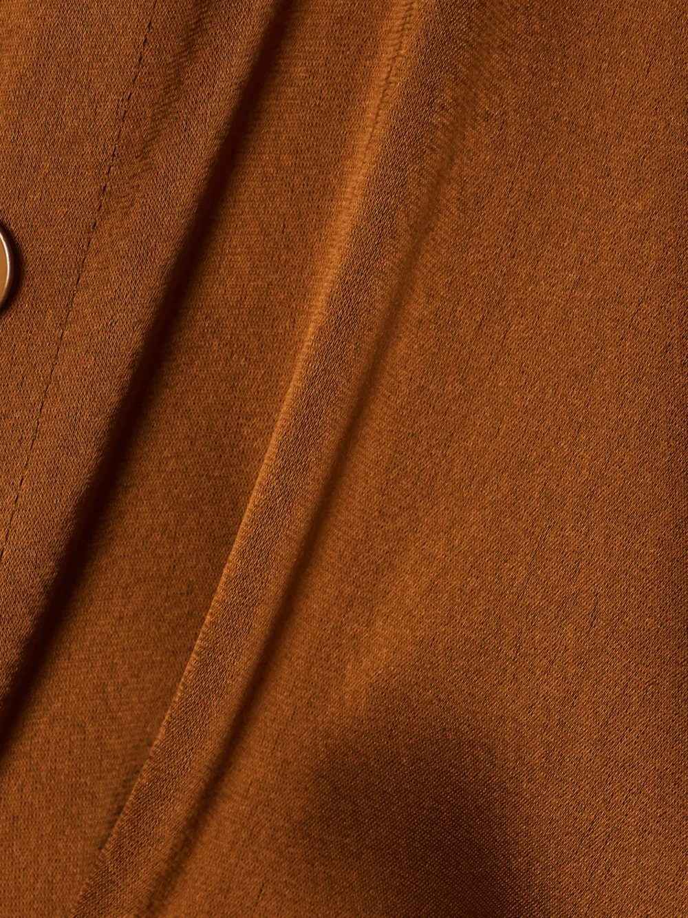 Close-up detail of the Galvan Hock Twist-front Cutout Satin Maxi Dress