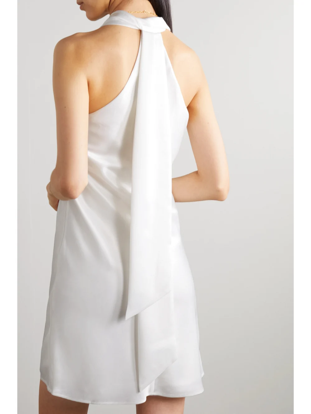Back view of the Galvan Pandora Tie-detailed Satin Halterneck Mini Dress