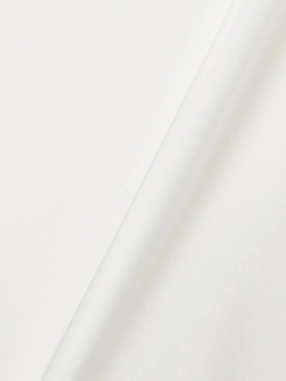Close-up detail of the Galvan Pandora Tie-detailed Satin Halterneck Mini Dress