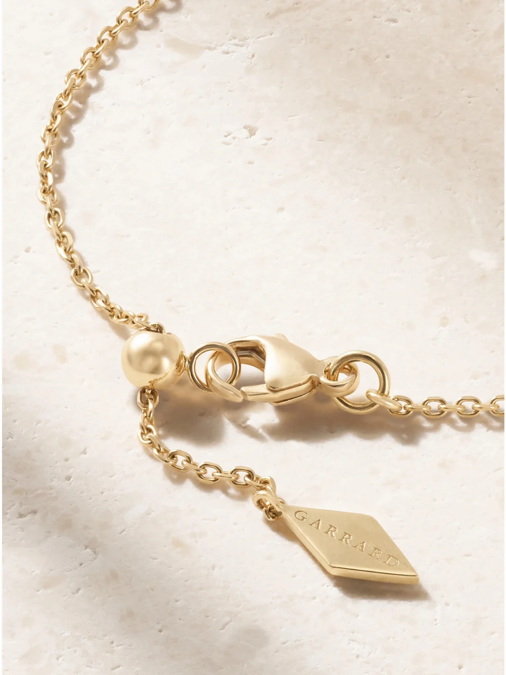 Back view of the Garrard Starlight Mini Icon 18-karat Gold and Diamond Necklace