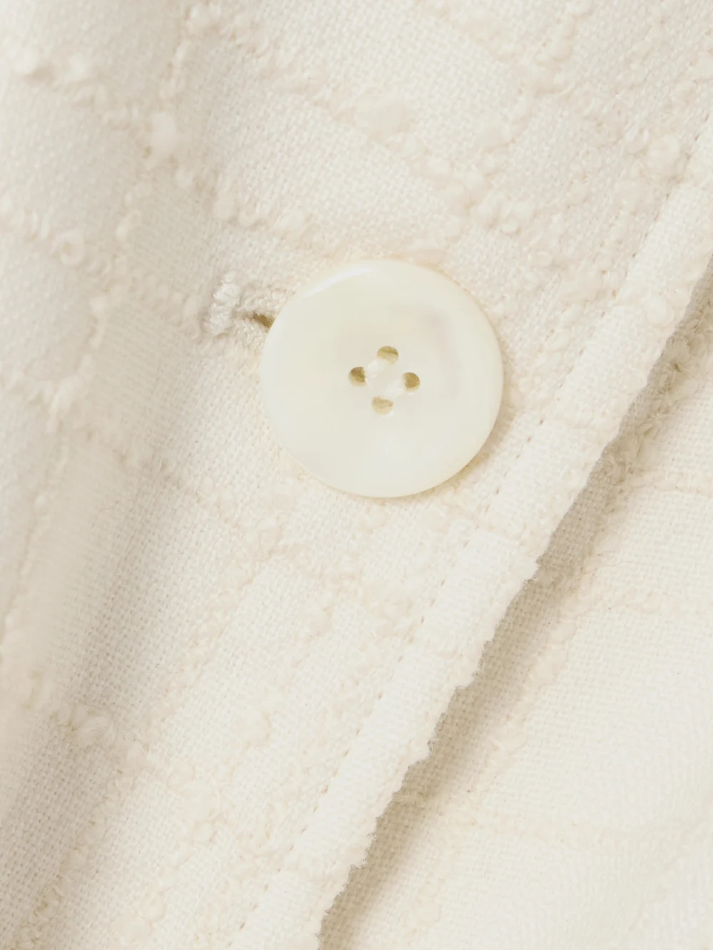 Close-up detail of the Giuliva Heritage The Vanessa Wool Bouclé-tweed Mini Dress