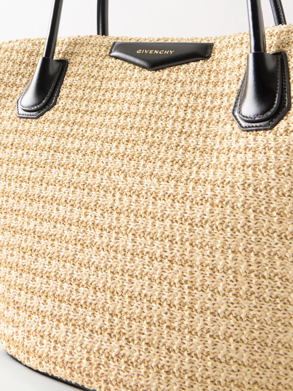 Close-up detail of the Givenchy Antigona Small Leather-trimmed Raffia Tote