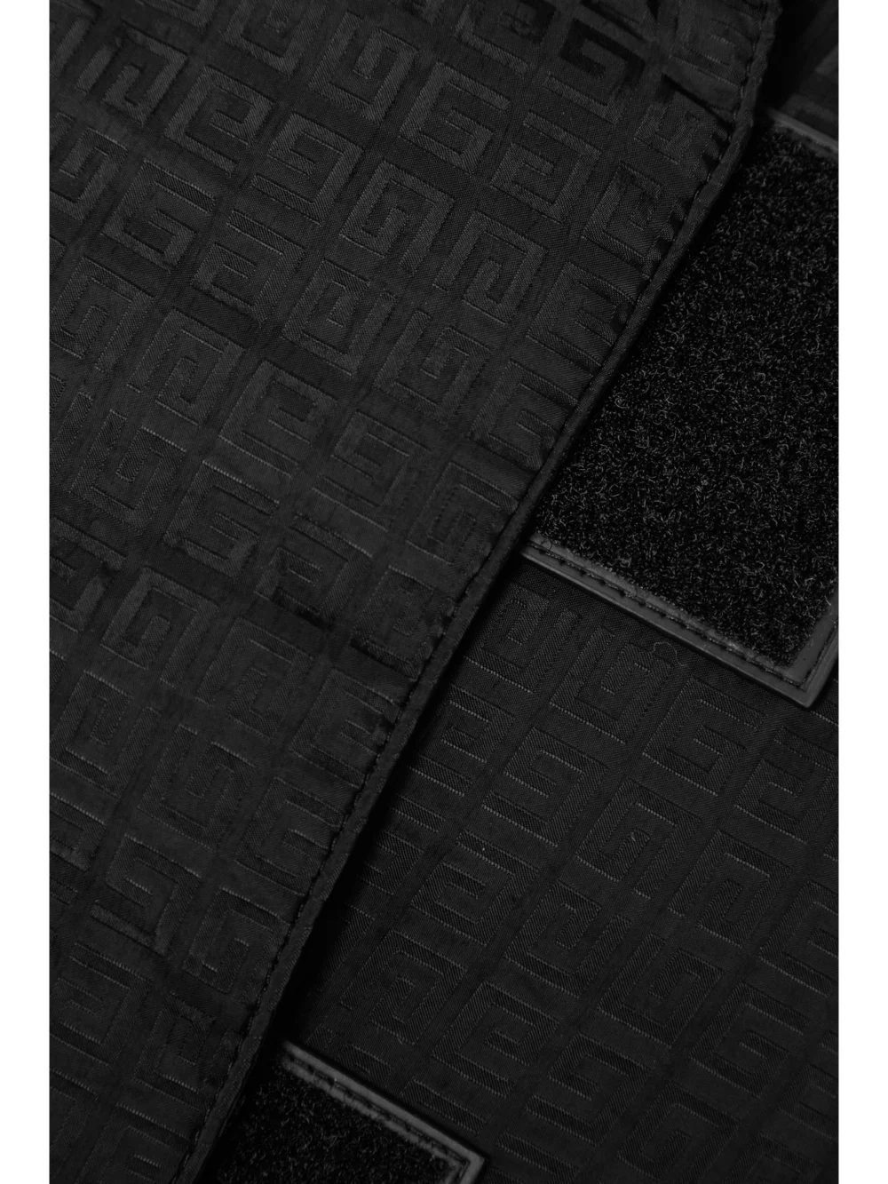 Close-up detail of the Givenchy Cropped Padded Wool Blend-trimmed Shell-jacquard Hooded Jacket