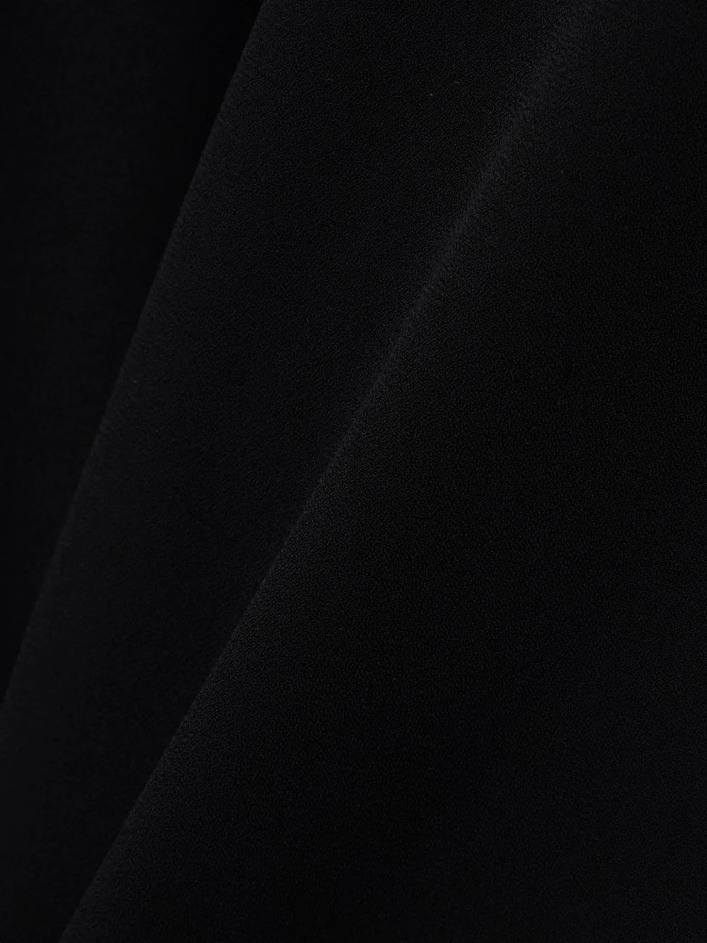 Close-up detail of the Givenchy Cutout Draped Crepe Mini Dress