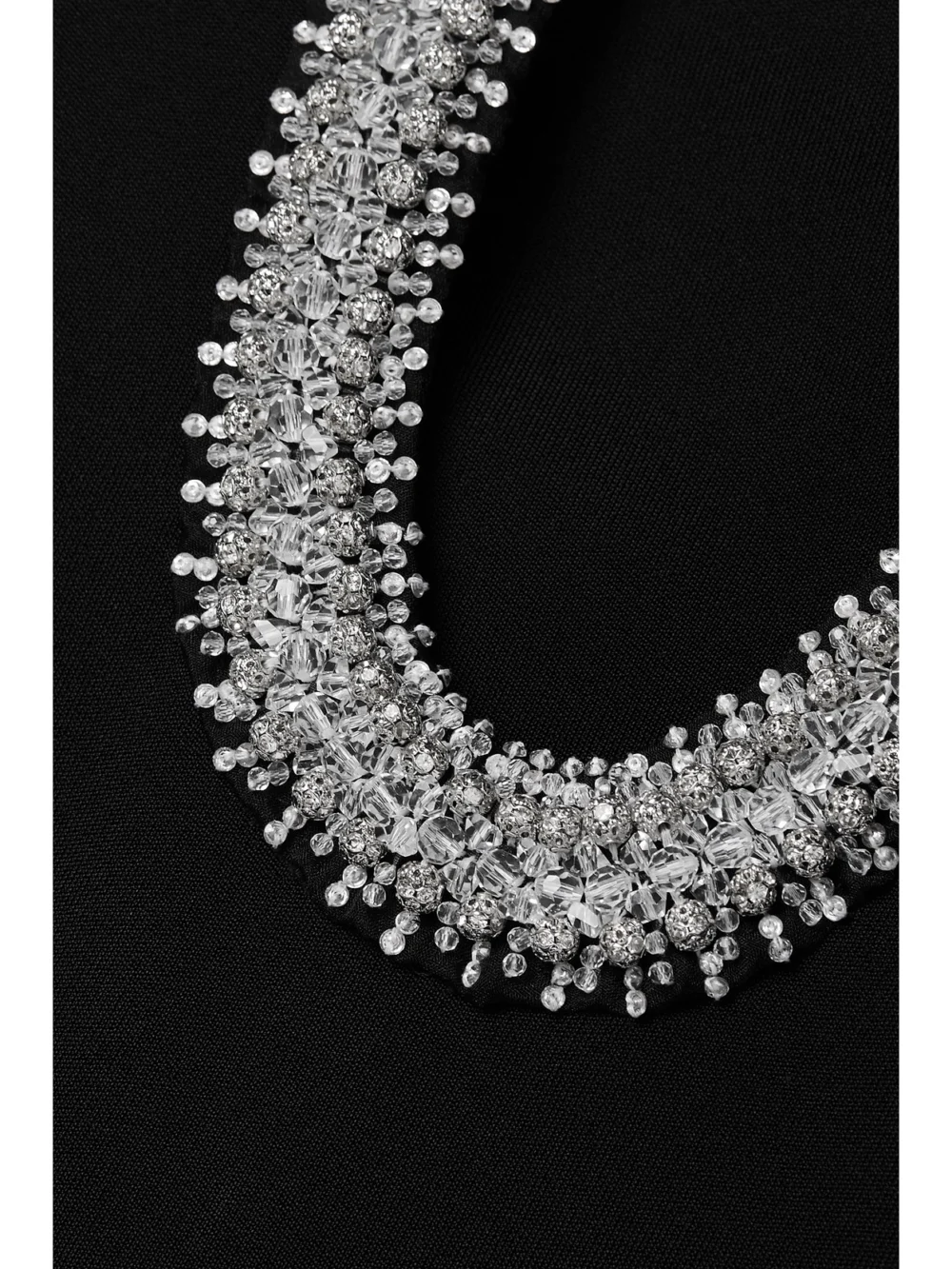 Close-up detail of the Givenchy Cutout Embellished Stretch-knit Dress