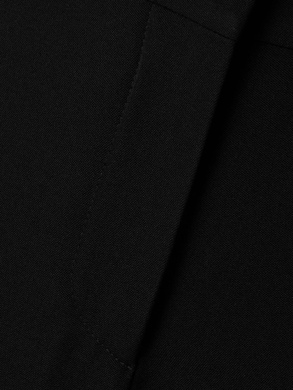 Close-up detail of the Givenchy Grain De Poudre Wool Flared Pants