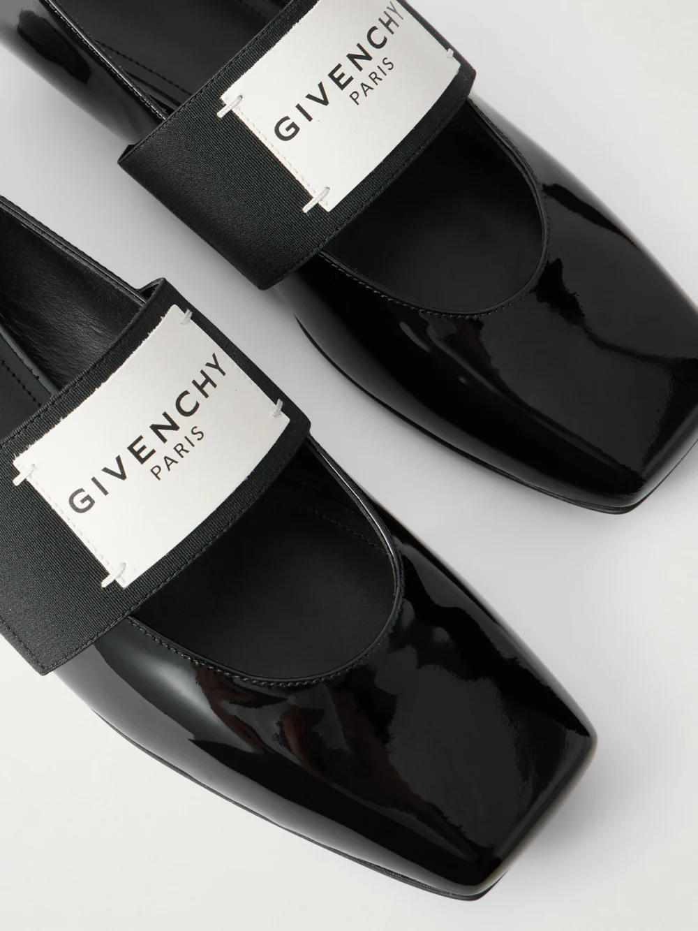 Close-up detail of the Givenchy Logo-appliquéd Patent-leather Ballet Flats