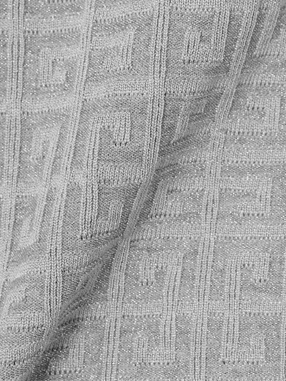 Close-up detail of the Givenchy Logo-jacquard Metallic Knitted Mini Skirt