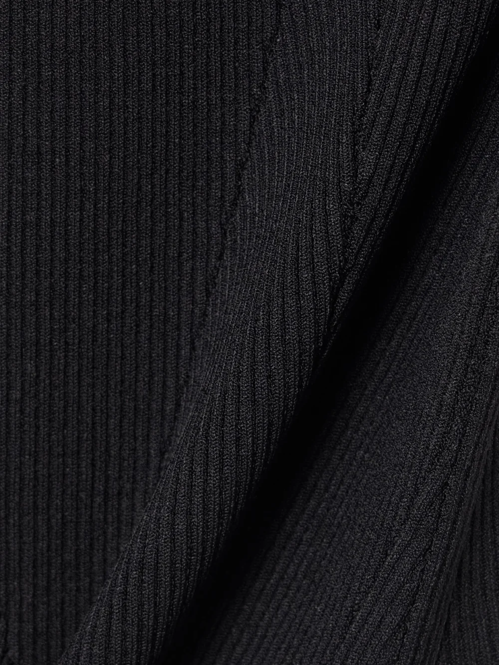 Close-up detail of the Givenchy Off-the-shoulder Paneled Ribbed-knit Top