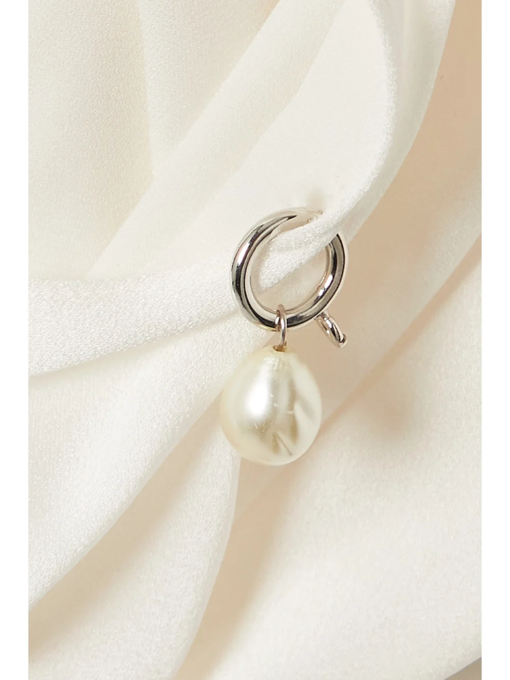 Close-up detail of the Givenchy Open-back Knotted Crepe Halterneck Top