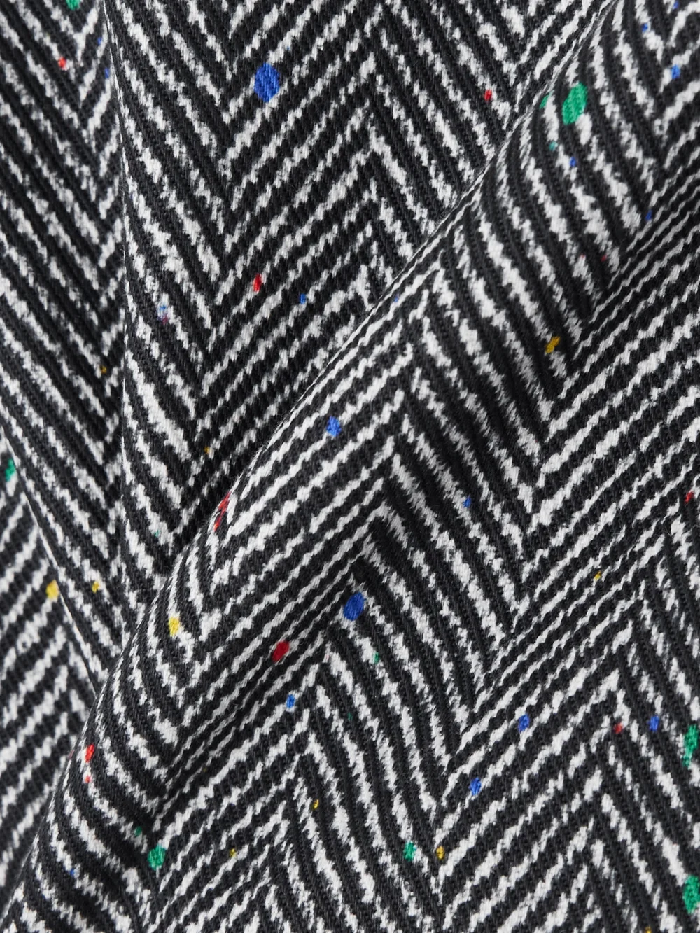 Close-up detail of the Givenchy Paneled Herringbone Cotton-twill Mini Skirt