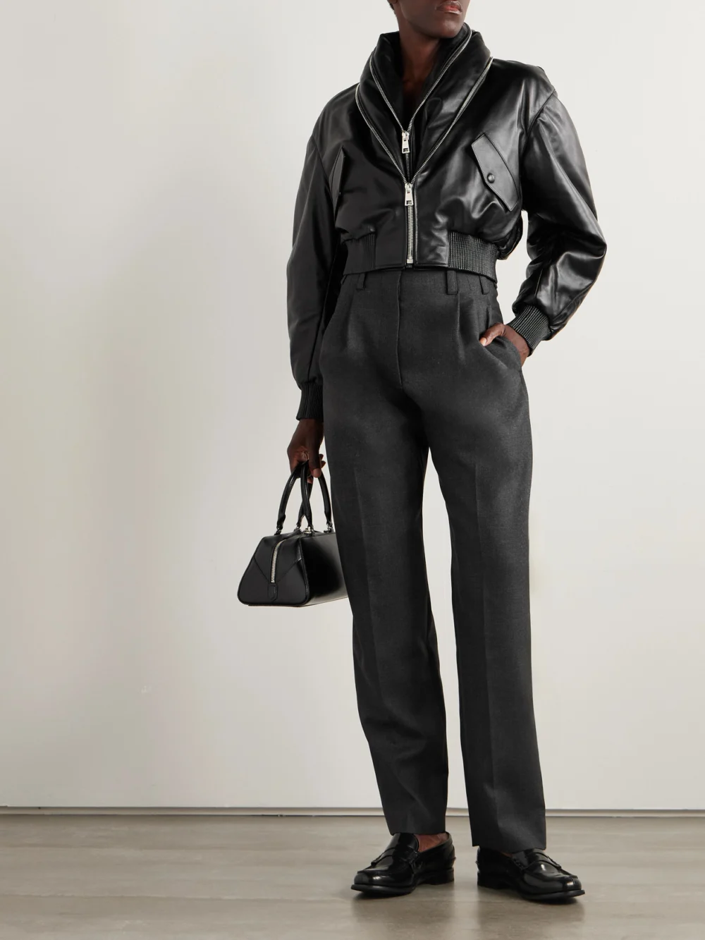 Givenchy Pleated Wool Tapered Pants, worn by a model
