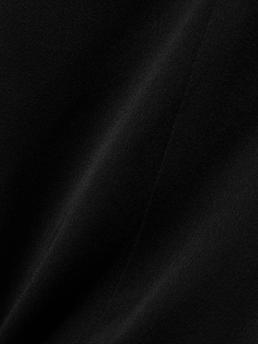 Close-up detail of the Givenchy Ruffled Crepe Halterneck Dress